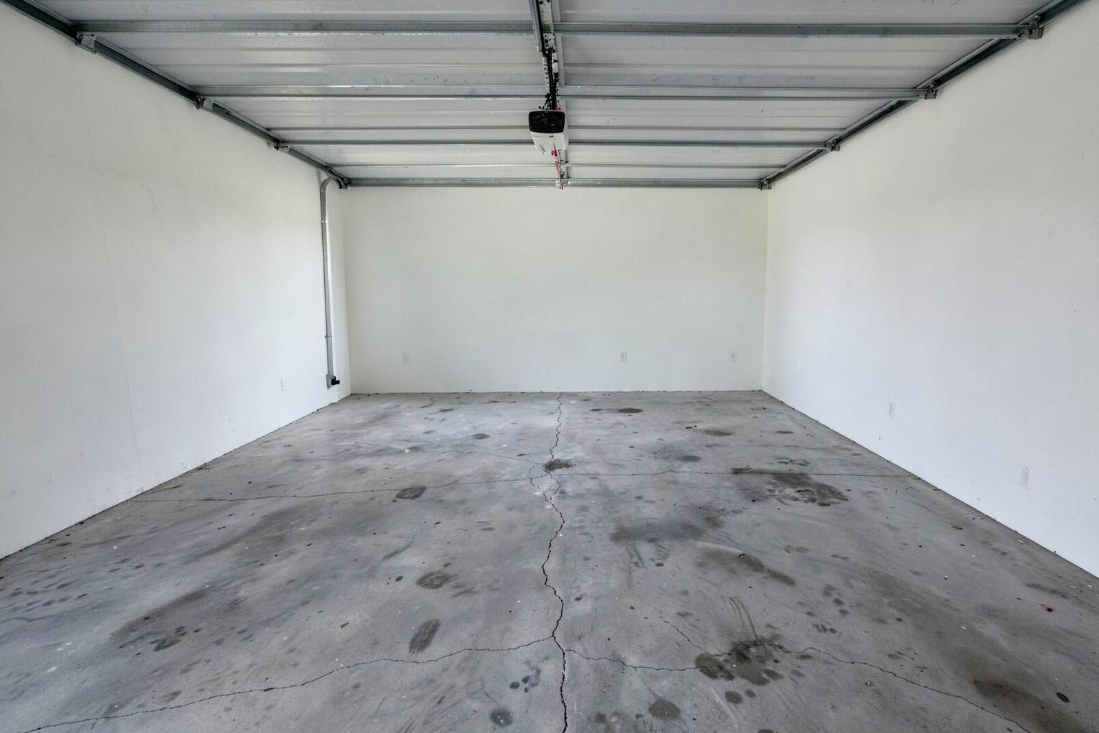 Unfinished concrete garage before demonstration